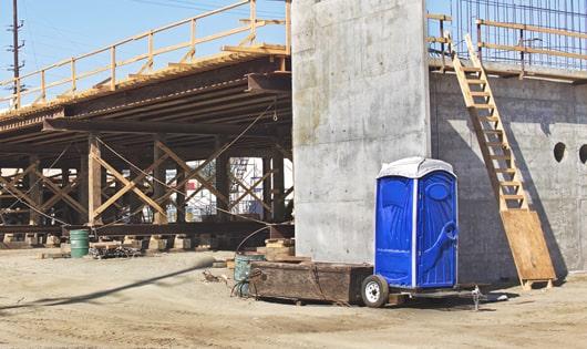 multiple portable restrooms arranged for easy access at a construction site